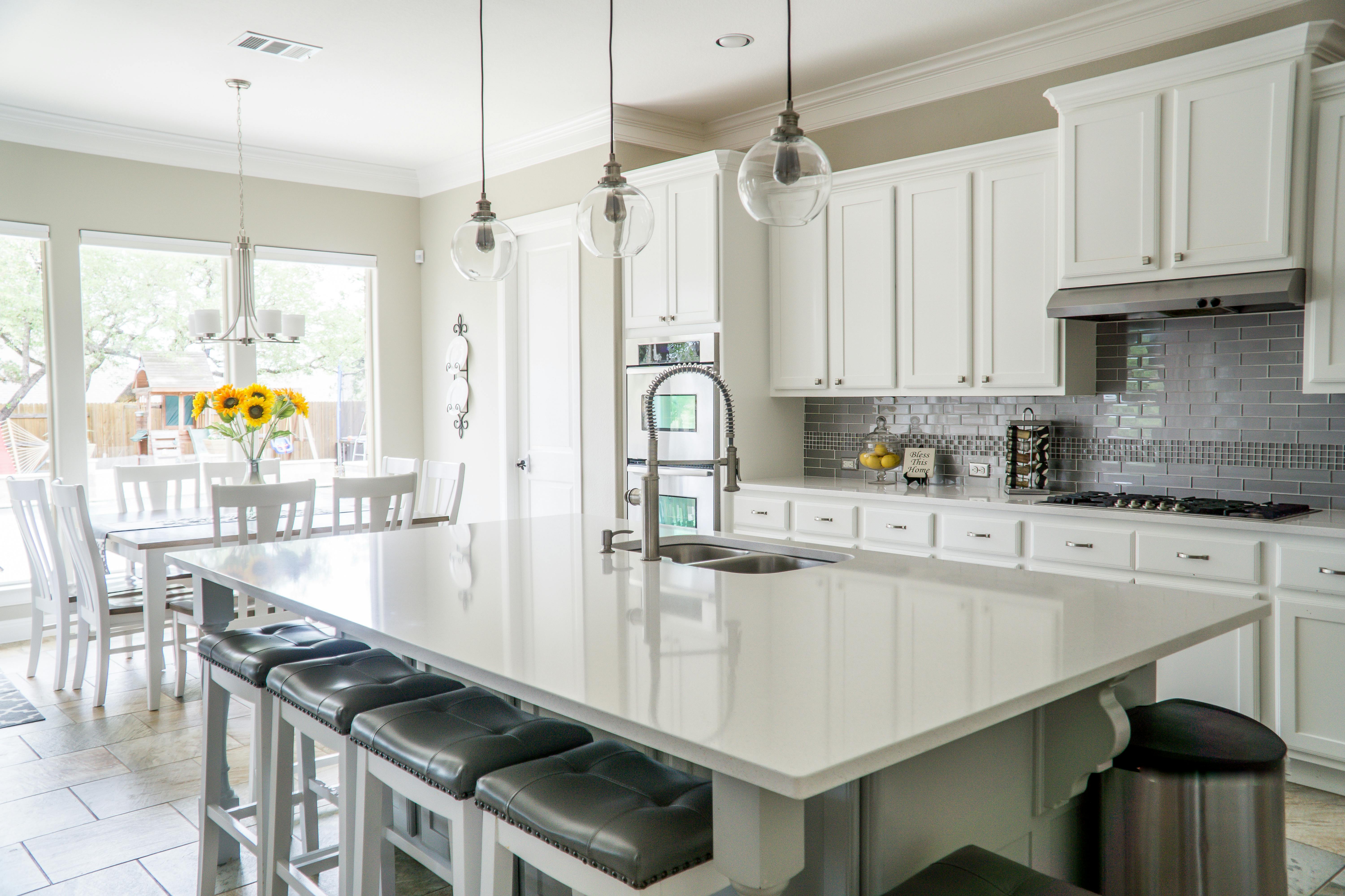 Beautiful modern kitchen remodel with white cabinets and quartz countertops